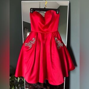 Authentic Sherri Hill red prom dress. Great condition! Has pockets. Size 2.